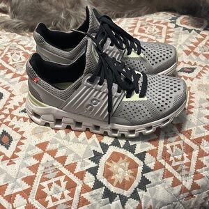 On Running Gray and Black Athletic Shoes